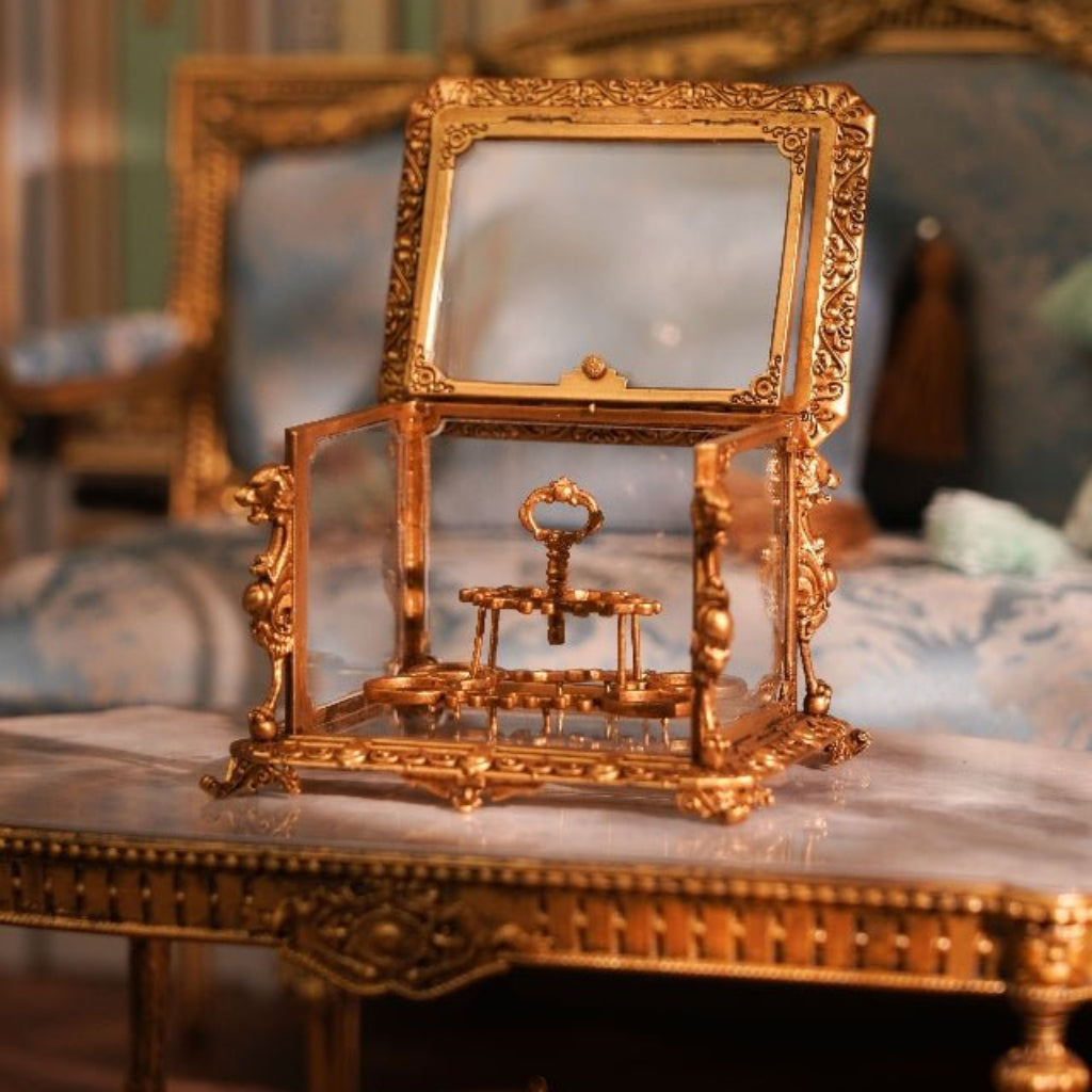 Ornate miniature display cabinet on a classical wooden table for desk decor - miniento