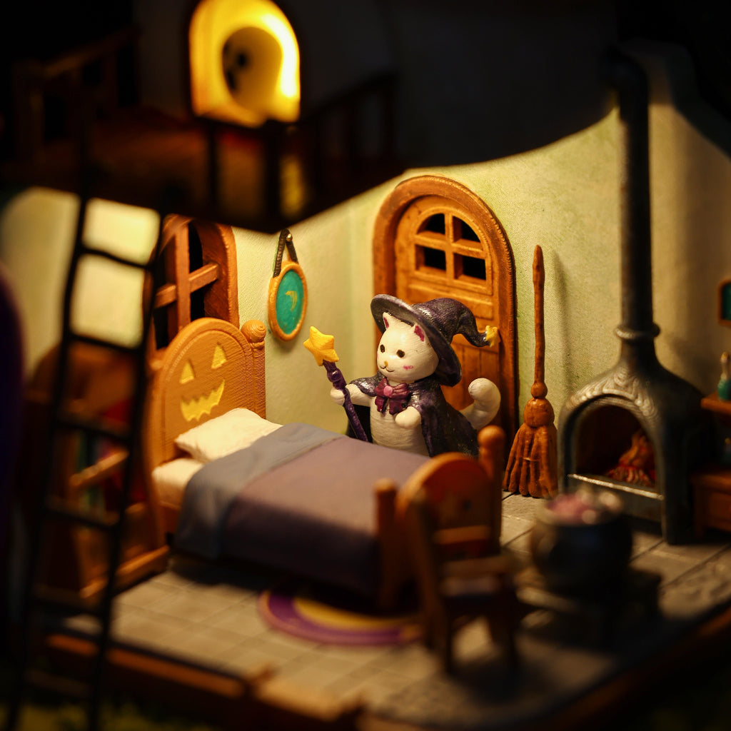 1:64 scale miniature The Cat Witch's House displayed in a Halloween village setting, spooky decor for collectors