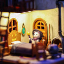 1:64 scale miniature The Cat Witch's House with LED lighting glowing inside, haunted house night display