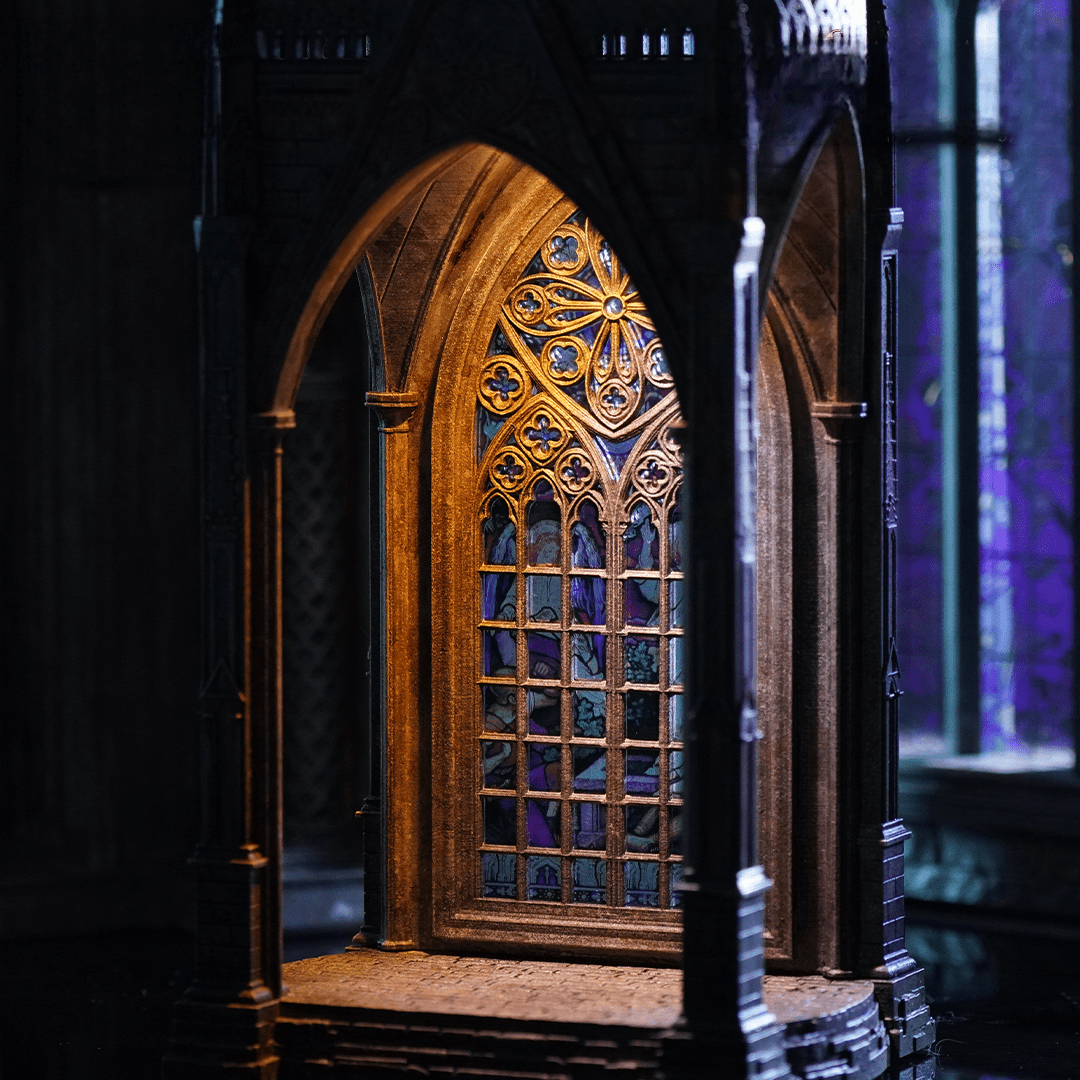 Low angle view of Gothic miniature church showing grand arched entrance - Miniento