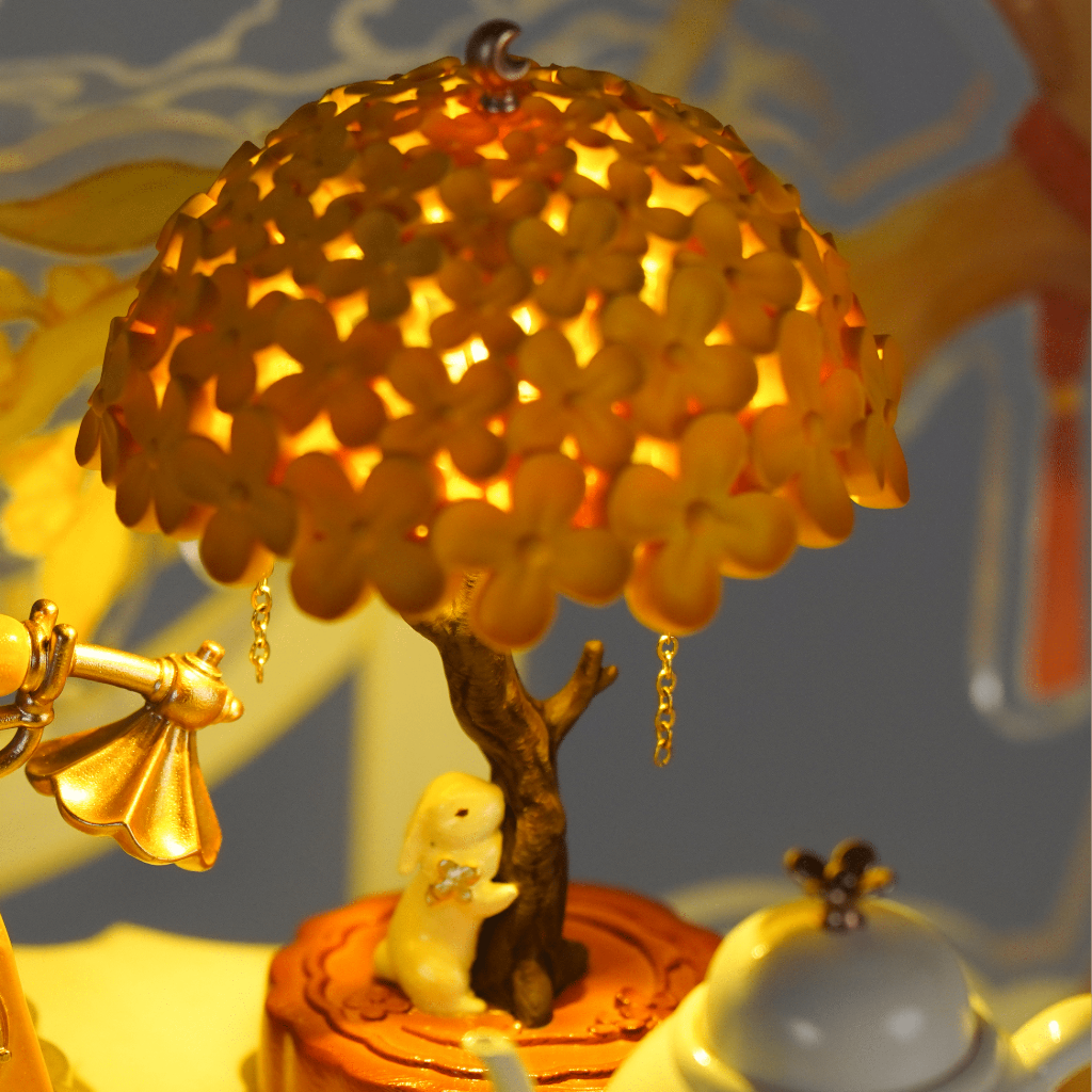 Laurel Rabbit LED lamp glowing tree leaves detail, enchanting 1:12 scale miniature night light with warm illuminated foliage