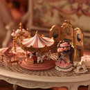 Miniature carousel gift collection main view, vintage-style rotating carousel with detailed horse figures and ornate canopy