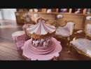 Display video of a lovely pink spinning carousel